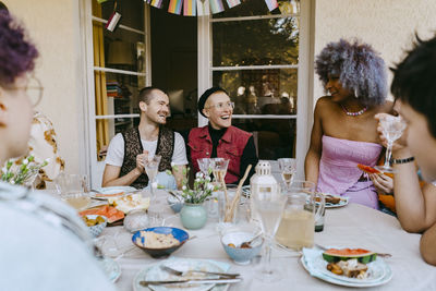 Friends toasting wineglasses at restaurant