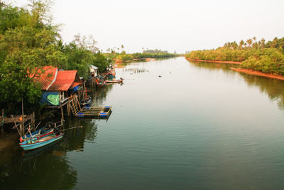 Boats in lake against sky