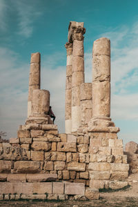 Low angle view of roman ruins against sky