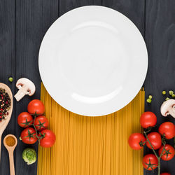 High angle view of tomatoes in plate on table