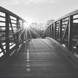 Bridge over river at sunset