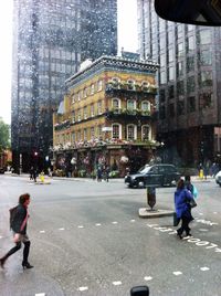 Woman standing on city street