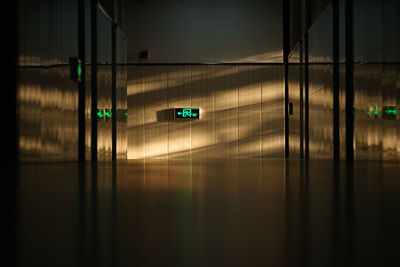 Low angle view of silhouette man standing in tunnel