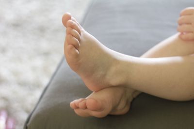 Low section of baby feet