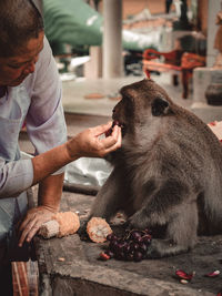 Midsection of man eating food