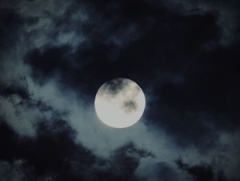 Low angle view of moon against sky at night