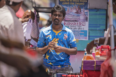 People working at market stall