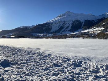 Scenic view of snowcapped mountains against sky
