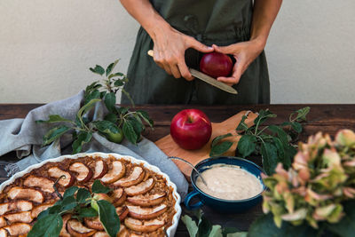 Midsection of woman preparing food on table