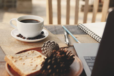 Close-up of coffee cup on table