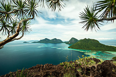 Scenic view of sea against cloudy sky