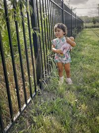 Full length of woman standing on grass