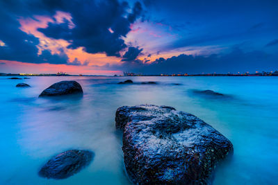 Scenic view of sea against sky at sunset