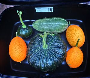 Close-up of orange fruits in container