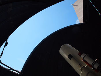 Low angle view of airplane against clear sky