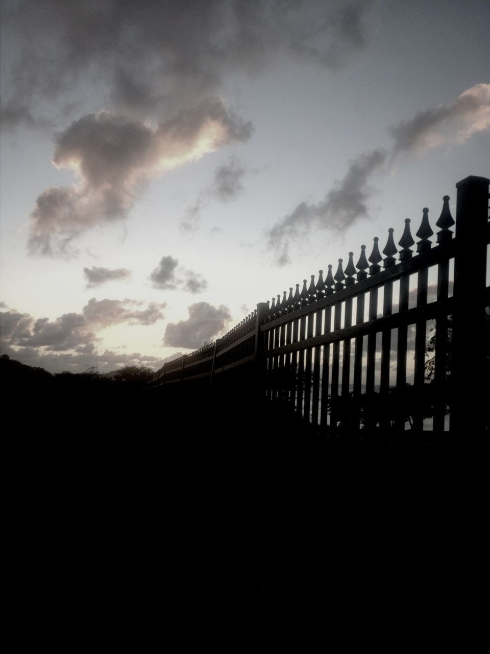 silhouette, sky, built structure, railing, low angle view, sunset, architecture, connection, bridge - man made structure, cloud - sky, fence, dusk, cloud, bridge, outdoors, nature, no people, metal, cloudy, engineering