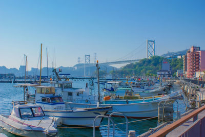 Boats moored at harbor