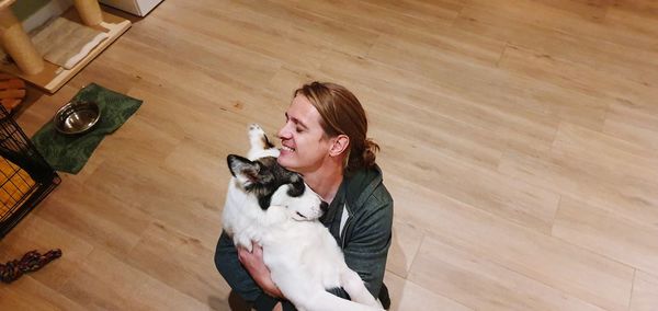 High angle view of woman and cat at home