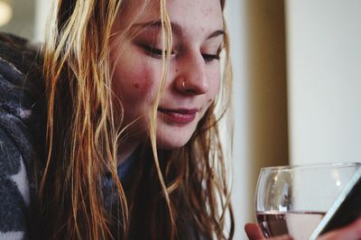 Close-up portrait of woman drinking glass