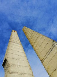 Low angle view of historical building against blue sky