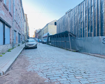 View of street amidst buildings in city