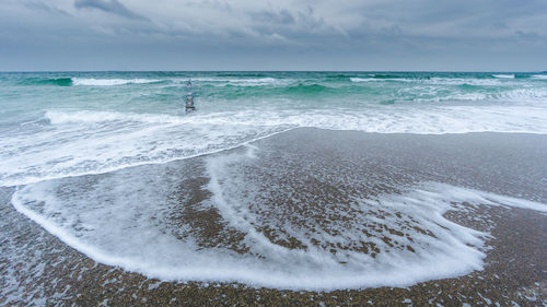 Scenic view of beach against sky