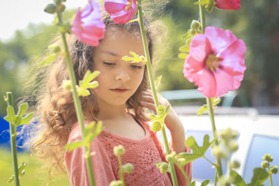 Close-up of girl with pink flowers