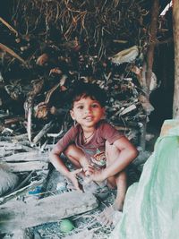 Portrait of a smiling girl sitting outdoors