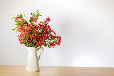 Close-up of flower vase on table