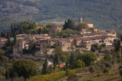 High angle view of buildings and trees in city