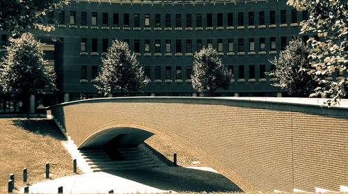 Arch bridge against building