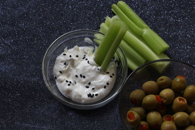 High angle view of vegetables with dip in bowl