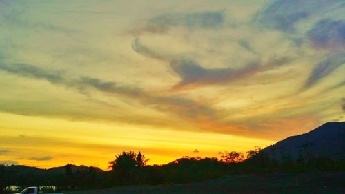 Scenic view of dramatic sky during sunset