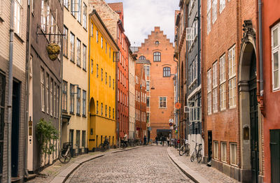 Narrow street amidst buildings in town