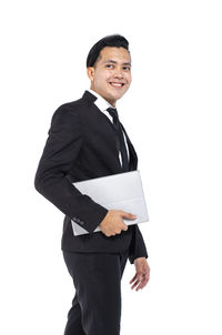 Portrait of a smiling man against white background