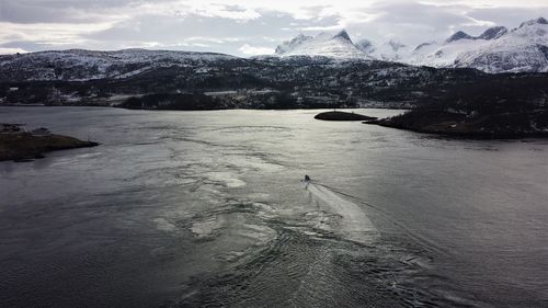 Scenic view of frozen lake against sky