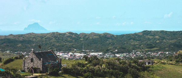 Scenic view of mountains and sea against clear sky