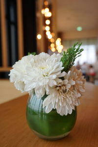 Close-up of white flower vase on table