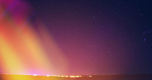 Low angle view of illuminated city at night