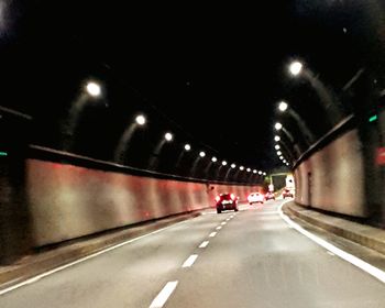 View of vehicles on road in tunnel