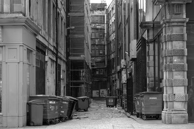 Narrow street amidst buildings in city