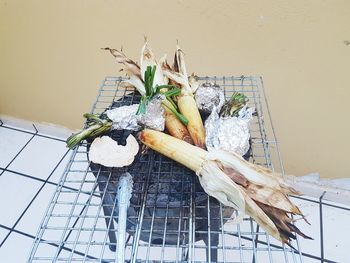 Close-up of vegetables roasting on metal grate