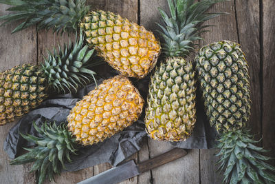 Fresh pineapples on the dark background