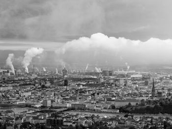 Aerial view of cityscape against sky