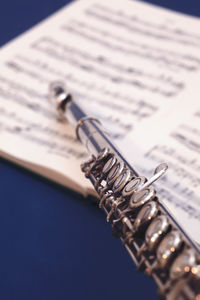 Close-up of flute on musical note