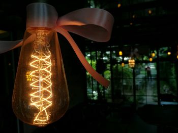 Close-up of illuminated light bulb