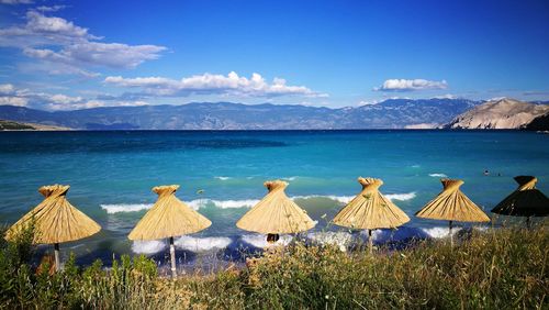 Scenic view of sea against blue sky