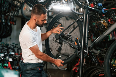 Side view of man riding bicycle