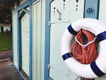Life guard ring and rope hanging on door