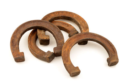 Close-up of rusty metal against white background